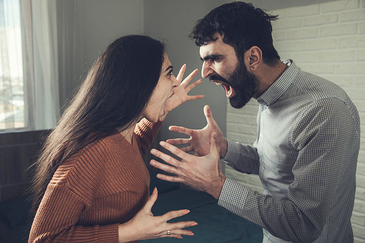 Angry and frustrated couple fighting and yelling at each other