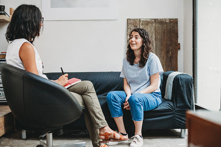 Young woman being supported in therapy
